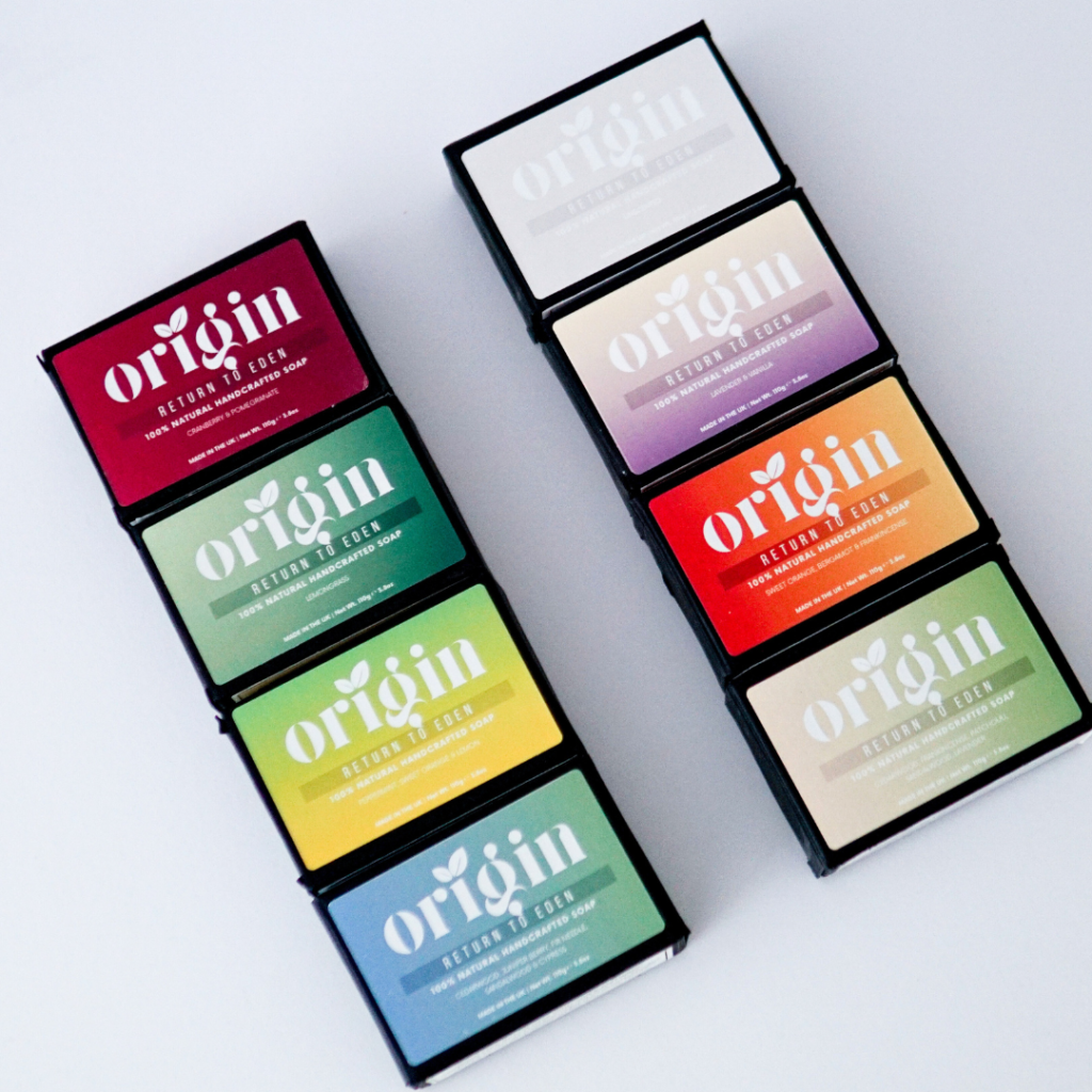Origin 8-bar tallow soap collection arranged in a styled flat-lay design.