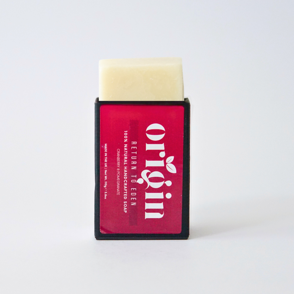 Pomegranate & Cranberry soap bar partially popping out of its upright box.