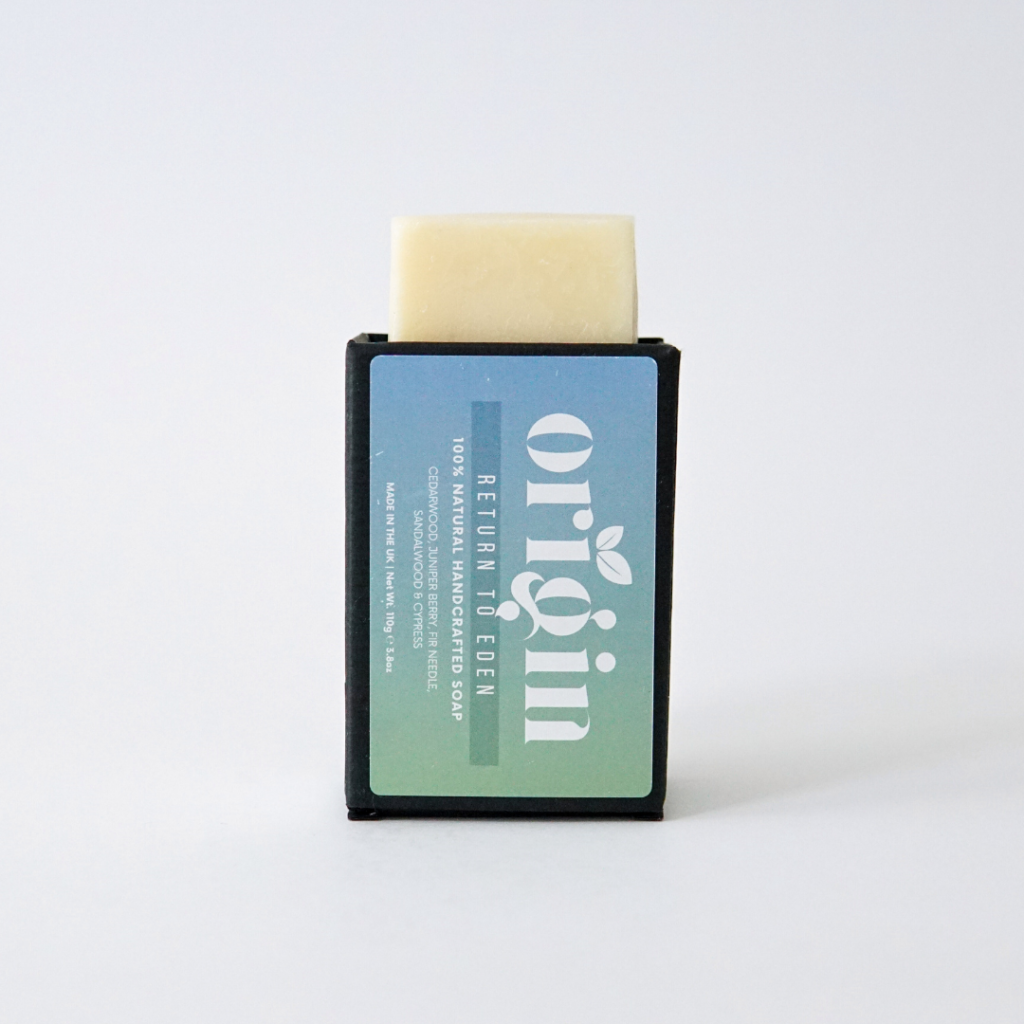 Cedarwood & Juniper Berry soap bar partially popping out of its upright packaging.