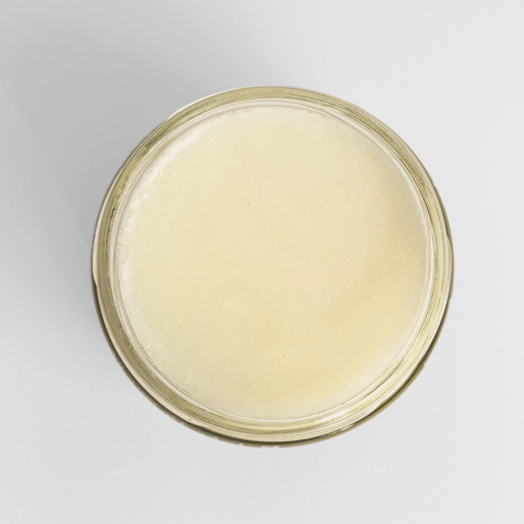 Open jar of organic beef tallow 300g top view