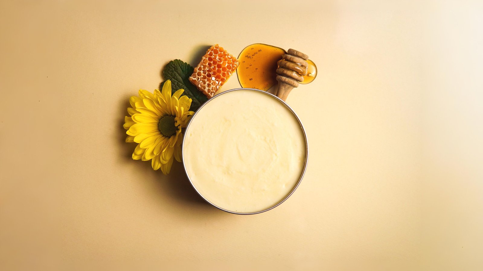 Whipped tallow and honey balm in glass jar with natural ingredients