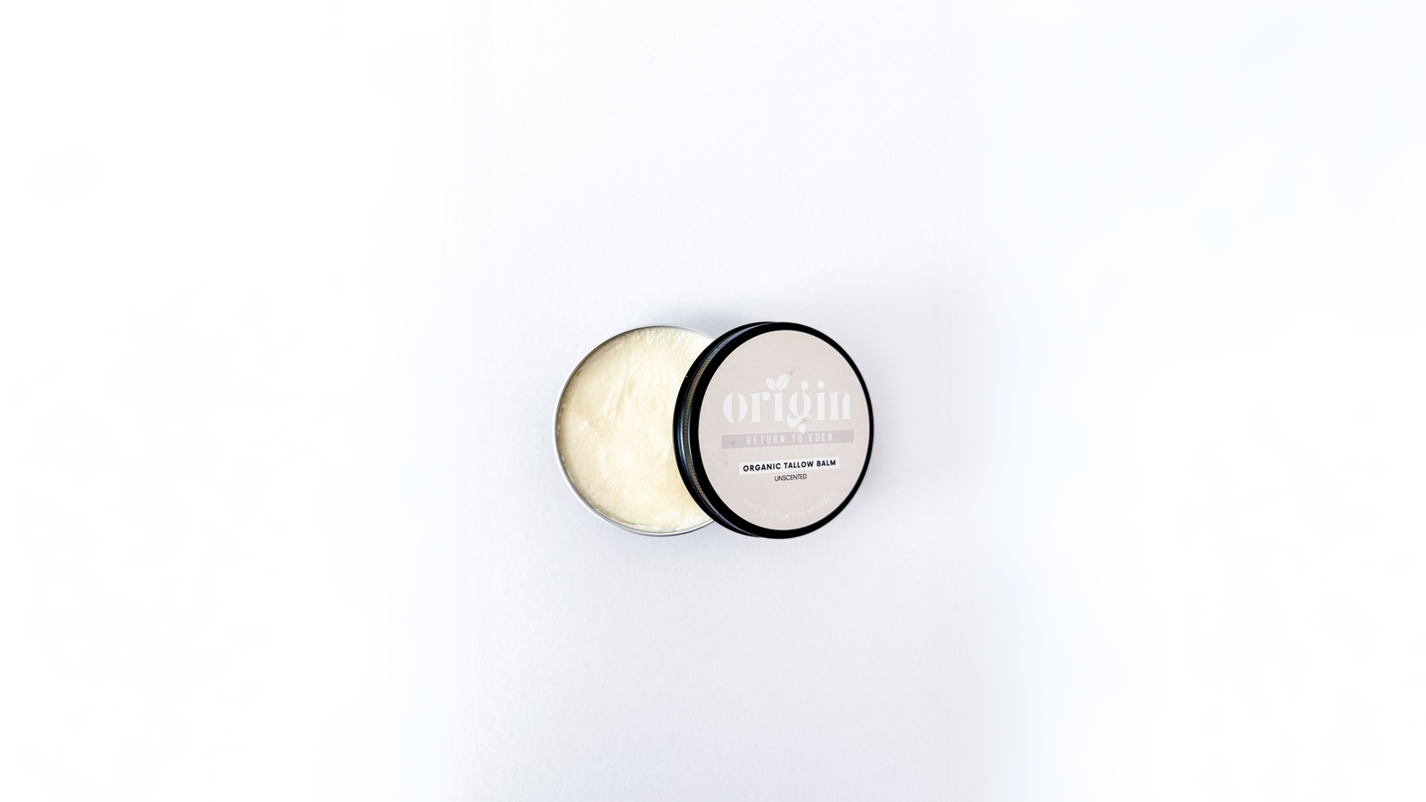 minimal skincare scene showing natural skin texture and soft lighting representing non-comedogenic tallow use